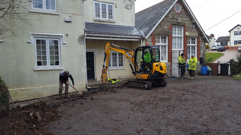 Trench digging in the car park of the Village Hall
