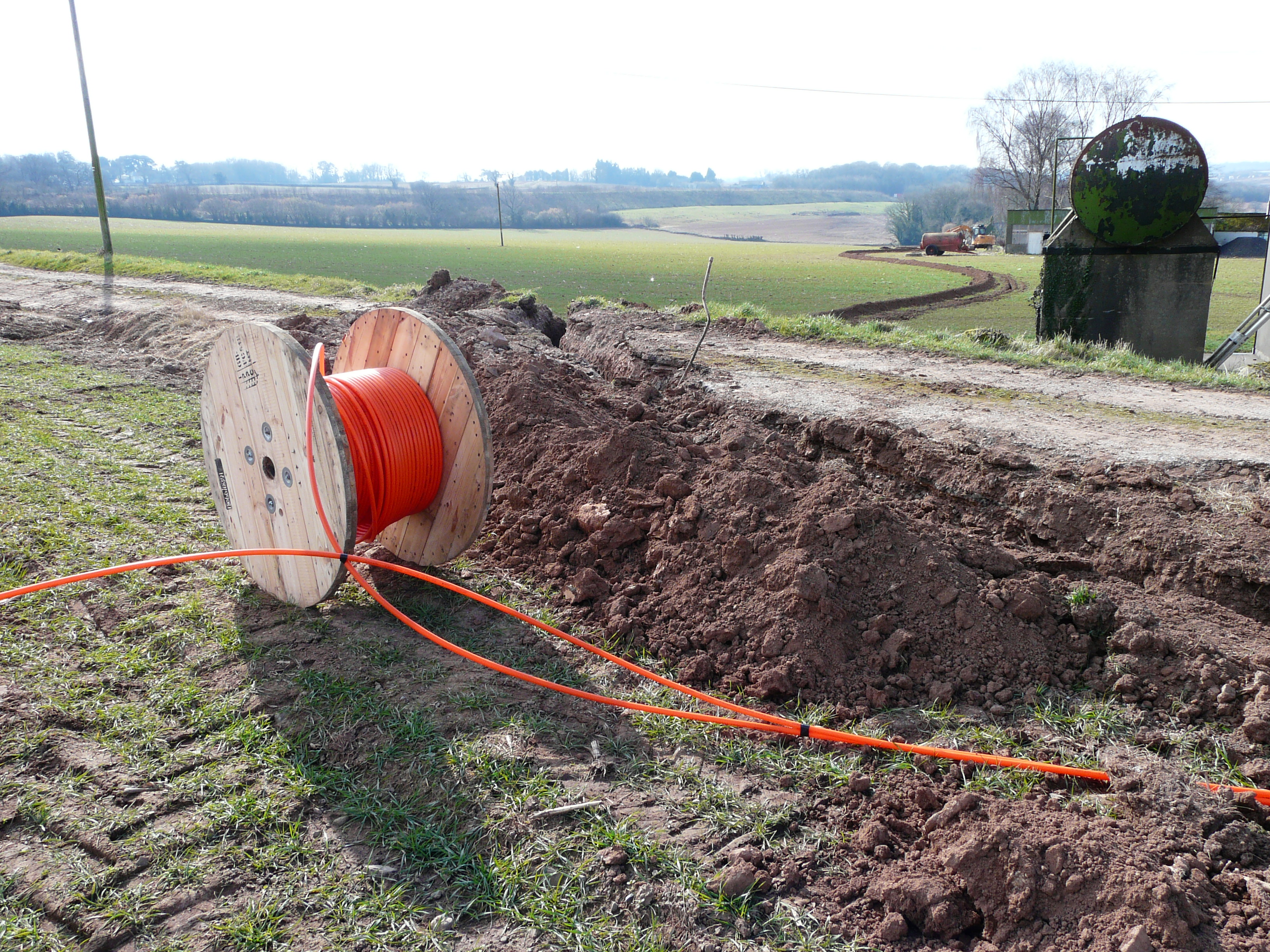 Tractor laying the ducting